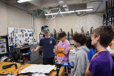 Bike cave manager speaks with students