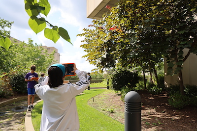 student photographs plants